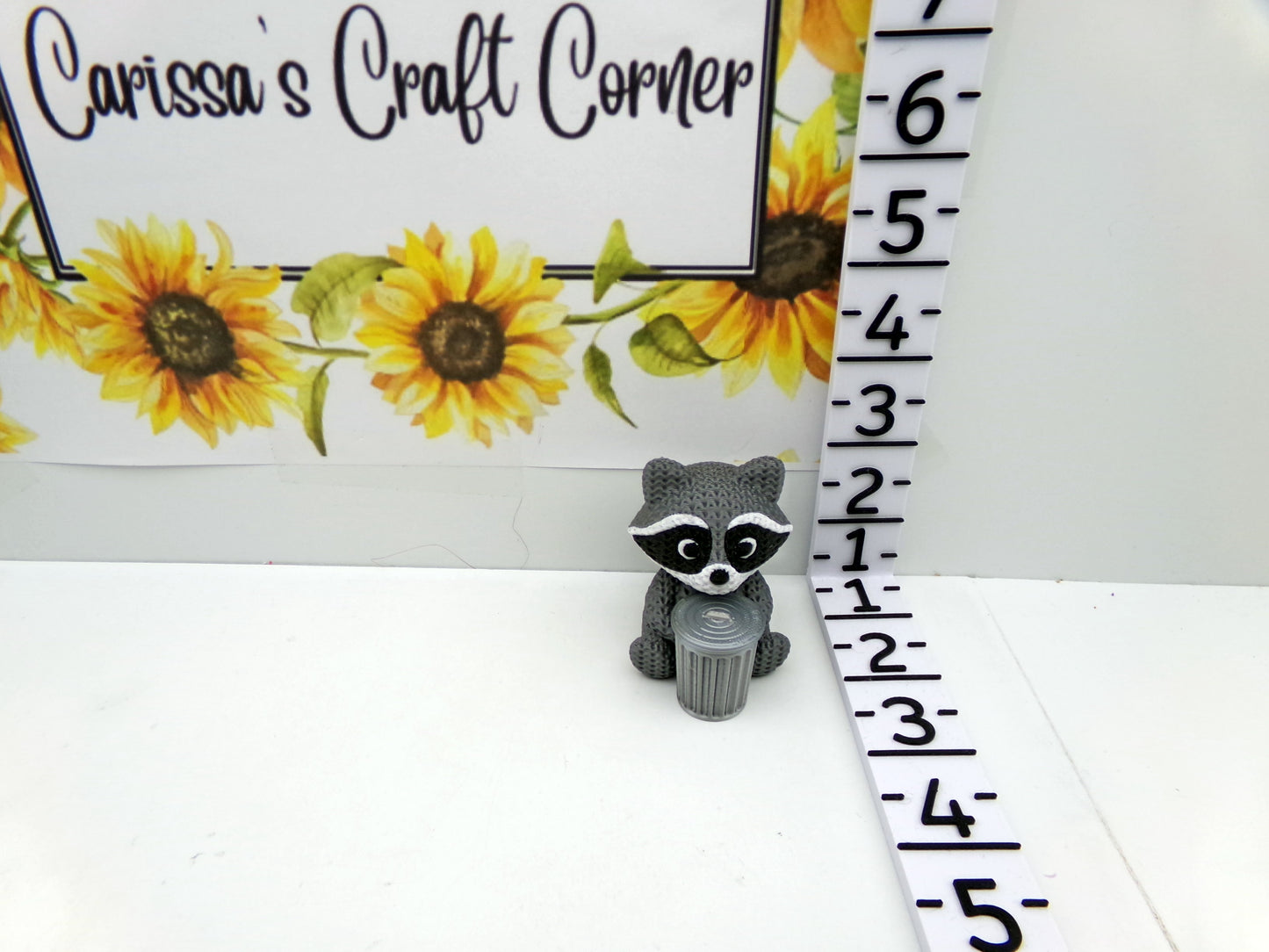 Racoon Cover Minder with a Drill Trash Can